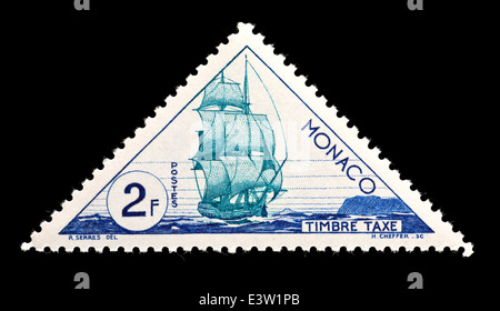Postage stamp from Monaco depicting an early sailing ship used to transport mail. Stock Photo