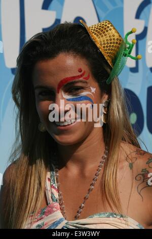 Rio de Janeiro, Brazil. 29th June 2014. 2014 FIFA World Cup Brazil. A young Brazilian with a face painting in the colors of the Dutch flag, at the FIFA Fan Fest in Copacabana Beach, before the match Netherlands 2x1 Mexico in the Round of 16. Face painting is very popular among fans in the World Cup. Rio de Janeiro, Brazil, 29th June, 2014. Credit:  Maria Adelaide Silva/Alamy Live News Stock Photo