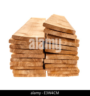 Stacks of one by six inch cedar boards on white background Stock Photo