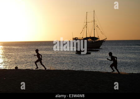 Fortaleza, Brazil. 29th June, 2014. Two boys play football on a beach in Fortaleza, Brazil, June 29, 2014. © Mauricio Valenzuela/Xinhua/Alamy Live News Stock Photo