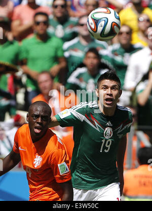 Fortaleza, Brazil. 29th June, 2014. Mexico's Oribe Peralta vies with Netherlands's Bruno Martins Indi during a Round of 16 match between Netherlands and Mexico of 2014 FIFA World Cup at the Estadio Castelao Stadium in Fortaleza, Brazil, on June 29, 2014. Credit:  Zhou Lei/Xinhua/Alamy Live News Stock Photo