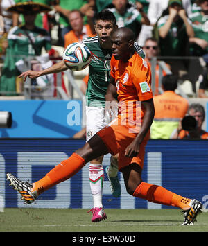 Fortaleza, Brazil. 29th June, 2014. Mexico's Oribe Peralta vies with Netherlands's Bruno Martins Indi during a Round of 16 match between Netherlands and Mexico of 2014 FIFA World Cup at the Estadio Castelao Stadium in Fortaleza, Brazil, on June 29, 2014. Credit:  Zhou Lei/Xinhua/Alamy Live News Stock Photo