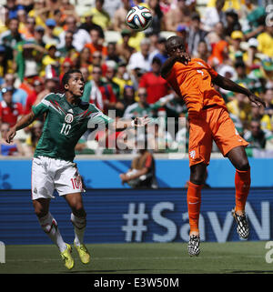 Fortaleza, Brazil. 29th June, 2014. Mexico's Giovani dos Santos vies with Netherlands's Bruno Martins Indi during a Round of 16 match between Netherlands and Mexico of 2014 FIFA World Cup at the Estadio Castelao Stadium in Fortaleza, Brazil, on June 29, 2014. Credit:  Zhou Lei/Xinhua/Alamy Live News Stock Photo