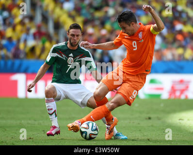 Fortaleza, Brazil. 29th June, 2014. Netherlands's Robin van Persie (R) vies with Mexico's Miguel Layun during a Round of 16 match between Netherlands and Mexico of 2014 FIFA World Cup at the Estadio Castelao Stadium in Fortaleza, Brazil, on June 29, 2014. Credit:  Li Ga/Xinhua/Alamy Live News Stock Photo