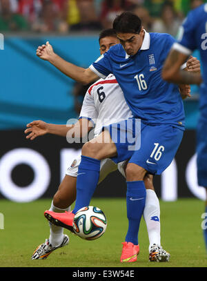 (140629) -- RECIFE, June 29, 2014 (Xinhua) -- Costa Rica's Oscar Duarte vies with Greece's Lazaros Christodoulopoulos during a Round of 16 match between Costa Rica and Greece of 2014 FIFA World Cup at the Arena Pernambuco Stadium in Recife, Brazil, on June 29, 2014.(Xinhua/Guo Yong)(rh) Stock Photo