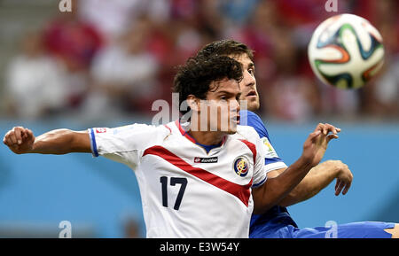 (140629) -- RECIFE, June 29, 2014 (Xinhua) -- Costa Rica's Yeltsin Tejeda (front) competes during a Round of 16 match between Costa Rica and Greece of 2014 FIFA World Cup at the Arena Pernambuco Stadium in Recife, Brazil, on June 29, 2014.(Xinhua/Yang Lei)(xzj) Stock Photo