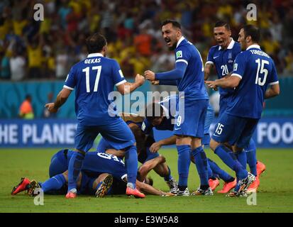 Recife, Brazil. 29th June, 2014. Greece's players celebrate the goal during a Round of 16 match between Costa Rica and Greece of 2014 FIFA World Cup at the Arena Pernambuco Stadium in Recife, Brazil, on June 29, 2014. Credit:  Guo Yong/Xinhua/Alamy Live News Stock Photo