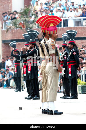 Indian-Pakistani border crossing Wagah, Attari Border, Punjab, India on July 19, 2012. The Wagah border closing 'lowering of the flags' ceremony or The Beating Retreat ceremony is a daily military practice that the security forces of India (Border Securit Stock Photo