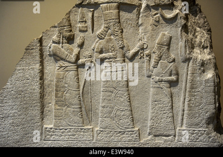 Stele with inscription and relief of Shamsh-res-usur praying in front of the Gods. 8th century BC. Limestone. Detail. Stock Photo