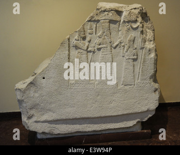 Stele with inscription and relief of Shamsh-res-usur praying in front of the Gods. 8th century BC. Limestone. Stock Photo