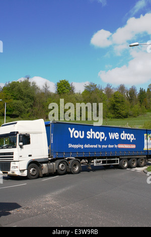 A Tesco truck entering a roundabout in Coulsdon, Surrey, England Stock Photo