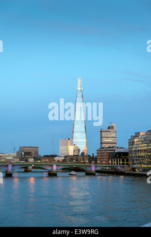 Late afternoon sun lights up the London skyline. The Shard is the tallest skyscraper in Western Europe.  Stock Photo