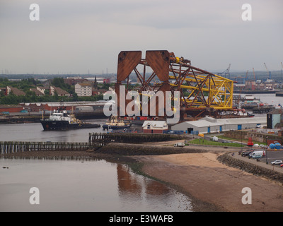 Oil rig support vessel, Magnus with Three tugs boats towing oil rig ...