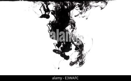 black ink dissolving in clear water Stock Photo