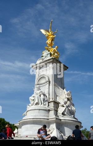 The Queen Victoria Memorial outside Buckingham Palace in Westminster. London. England. With tourists. Stock Photo