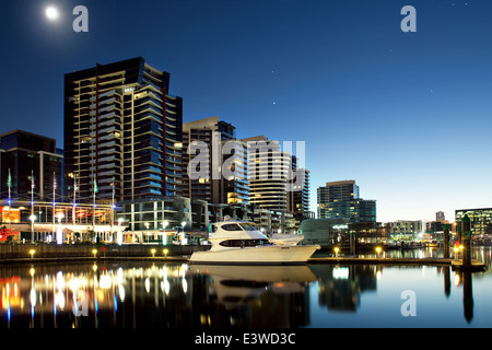 Melbourne, Australia yacht / boat in Redevelopment Docklands area of city docks with night lights. Australian city wharf. Stock Photo