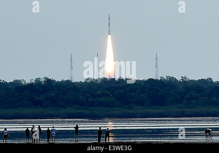 Sriharikota, India. 30th June, 2014. The Polar Satellite Launch Vehicle C-23 rocket lifts off from the east coast island of Sriharikota, India, June 30, 2014. Indian Space Research Organisation (ISRO) on Monday successfully launched the Polar Satellite Launch Vehicle C-23 rocket at 9:52 a.m. local time with five foreign satellites from Satish Dhawan Space Centre in Sriharikota of south Indian state of Andhra Pradesh. Credit:  Stringer/Xinhua/Alamy Live News Stock Photo