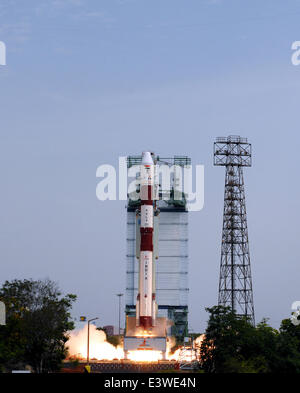 Sriharikota, India. 30th June, 2014. The Polar Satellite Launch Vehicle C-23 rocket lifts off from the east coast island of Sriharikota, India, June 30, 2014. Indian Space Research Organisation (ISRO) on Monday successfully launched the Polar Satellite Launch Vehicle C-23 rocket at 9:52 a.m. local time with five foreign satellites from Satish Dhawan Space Centre in Sriharikota of south Indian state of Andhra Pradesh. Credit:  Stringer/Xinhua/Alamy Live News Stock Photo