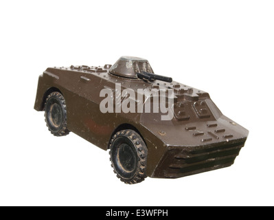 Children's toy: a very old toy tank metal green isolated on white background. Stock Photo