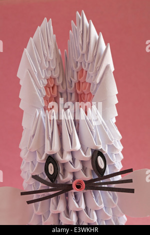 origami bunny rabbit set on pink background Stock Photo
