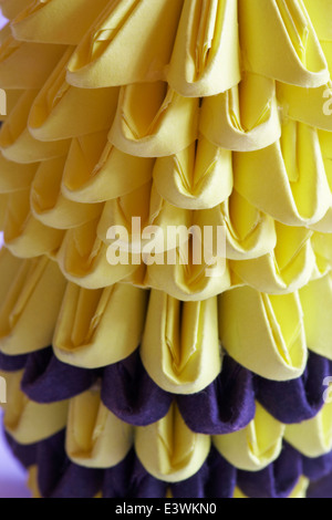close up detail of yellow and black folded paper in origami bumble bee Stock Photo
