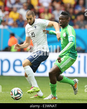 Brasilia, Brazil. 30th June, 2014. France's Karim Benzema vies with Nigeria's Kenneth Omeruo during a Round of 16 match between France and Nigeria of 2014 FIFA World Cup at the Estadio Nacional Stadium in Brasilia, Brazil, on June 30, 2014. Credit:  Li Ming/Xinhua/Alamy Live News Stock Photo