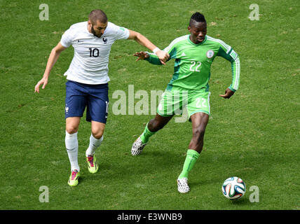 Brasilia, Brazil. 30th June, 2014. France's Karim Benzema vies with Nigeria's Kenneth Omeruo during a Round of 16 match between France and Nigeria of 2014 FIFA World Cup at the Estadio Nacional Stadium in Brasilia, Brazil, on June 30, 2014. Credit:  Liu Dawei/Xinhua/Alamy Live News Stock Photo