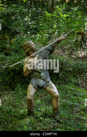 Cro-magnon hunter throwing spear with help of spear-thrower / atlatl, Prehisto Parc, Tursac, Périgord, Dordogne, France Stock Photo