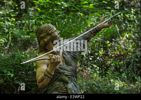 Cro-magnon hunter throwing spear with help of spear-thrower / atlatl, Prehisto Parc, Tursac, Périgord, Dordogne, France Stock Photo