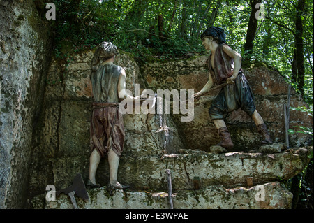 Medieval quarry workers cutting stones, Grottes du Roc de Cazelle, Les Eyzies, Dordogne, Périgord, France Stock Photo