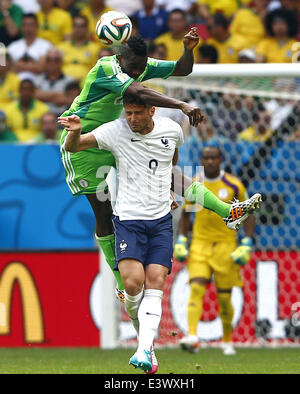 Brasilia, Brazil. 30th June, 2014. France's Olivier Giroud vies with Nigeria's Kenneth Omeruo during a Round of 16 match between France and Nigeria of 2014 FIFA World Cup at the Estadio Nacional Stadium in Brasilia, Brazil, on June 30, 2014. France won 2-0 over Nigeria and qualified for quarter-finals here on Monday. Credit:  Liu Bin/Xinhua/Alamy Live News Stock Photo