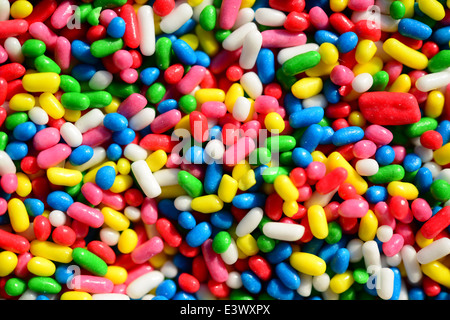 Extreme macro shot of sweet candies spreading pastry decoration Stock Photo