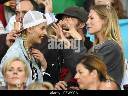 Porto Alegre, Brazil. 30th June, 2014. Lena Gercke(L), girlfriend of Germany's Sami Khedira, Sarah Brandner (R), girlfriend of Germany's Bastian Schweinsteiger and Thomas Hayo seen in the stands during the FIFA World Cup 2014 round of 16 soccer match between Germany and Algeria at the Estadio Beira-Rio in Porto Alegre, Brazil, 30 June 2014. Photo: Marcus Brandt/dpa/Alamy Live News Stock Photo