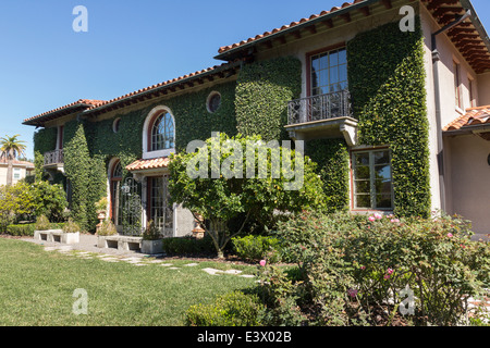 Exterior of a SPANISH STYLE LUXURY HOME with stucco walls a red tile ...