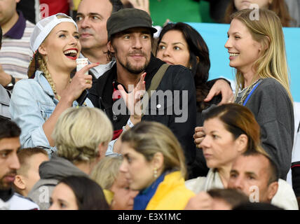 Porto Alegre, Brazil. 30th June, 2014. Lena Gercke (L), girlfriend of Germany's Sami Khedira, Sarah Brandner (R), girlfriend of Germany's Bastian Schweinsteiger and Thomas Hayo seen in the stands during the FIFA World Cup 2014 round of 16 soccer match between Germany and Algeria at the Estadio Beira-Rio in Porto Alegre, Brazil, 30 June 2014. Photo: Marcus Brandt/dpa/Alamy Live News Stock Photo