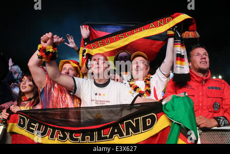 Berlin, Germany. 1st July, 2014. German football fan celebrate as they watch the 2014 World Cup round of 16 soccer match between Germany and Algeria at a public viewing event in Berlin, June 30, 2014. © Xinhua/Alamy Live News Stock Photo