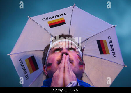 Berlin, Germany. 1st July, 2014. A German football fan reacts as he watches the 2014 World Cup round of 16 soccer match between Germany and Algeria at a public viewing event in Berlin, June 30, 2014. © Xinhua/Alamy Live News Stock Photo