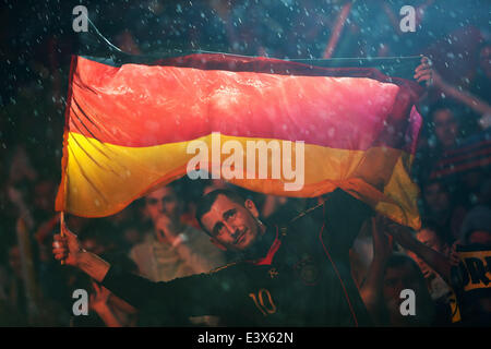 Berlin, Germany. 1st July, 2014. A German football fan reacts as he watches the 2014 World Cup round of 16 soccer match between Germany and Algeria at a public viewing event in Berlin, June 30, 2014. © Xinhua/Alamy Live News Stock Photo