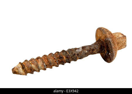 rusted heavy duty bolt used to secure railway line to sleepers Stock Photo