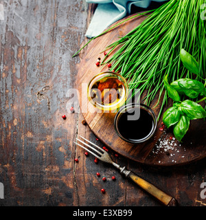 Herbs, condiments and spices on wooden background. Top view Stock Photo ...