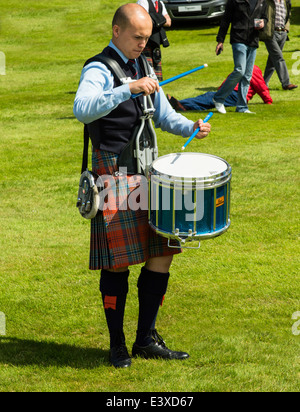 DRUMMER CONCENTRATING ON HIS RHYTHM AT THE EUROPEAN PIPE BAND CHAMPIONSHIPS IN FORRES SCOTLAND 2014