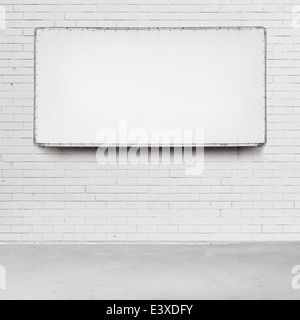 Blank advertising billboard on a brick wall. Stock Photo
