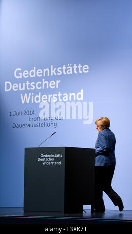 Berlin, Germany. 1st July, 2014. German Chancellor Angela Merkel walks to the lectern during the official inauguration of the newly designed permanent exhibition at the German Resistance Memorial Center in Berlin, Germany, 01 July 2014. The new permamnent exhibition 'Resistance against National Socialism' is housed in a part of the Bendlerblock, the headquarters of a  resistance group of Wehrmacht officers who carried out the 20 July plot against Adolf Hitler in 1944. Credit:  dpa picture alliance/Alamy Live News Stock Photo