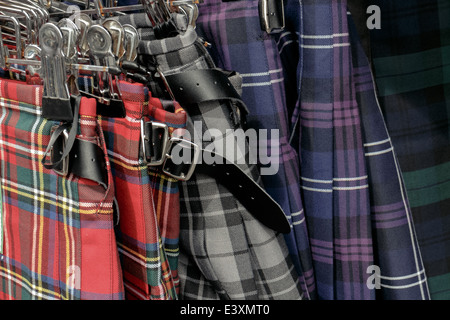Cheap tartan kilts on a rack outside a tourist shop in Edinburgh, Scotland Stock Photo