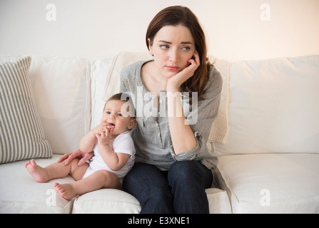 Mother with new baby suffering from postpartum depression Stock Photo