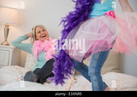 Senior Caucasian woman and granddaughter playing dress up Stock Photo