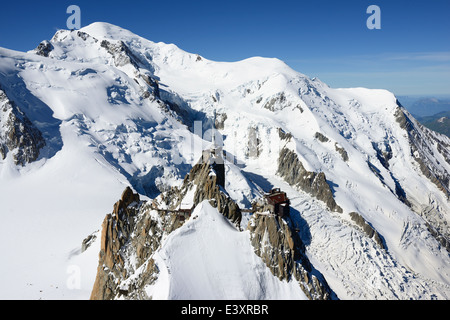 AERIAL VIEW. Aiguille du Midi (elevation: 3842m) and Mont-Blanc (elevation: 4810m). Chamonix Mont-Blanc, Haute-Savoie, Auvergne-Rhône-Alpes, France. Stock Photo