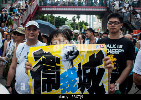 Hong Kong, China. 1st July, 2014. Thousands of people gather during the March of Democracy at the streets of Hong Kong on July 01 2014 in Hong Kong, China. Occupy Central organisation called to demonstrate in the streets after the celebration of the non legal referendum to ask for democracy in Hong Kong. Credit:  Xaume Olleros/Alamy Live News Stock Photo