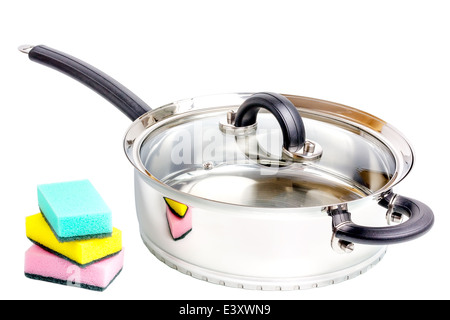 Stainless steel deep stewing pan with sponges isolated on white background Stock Photo
