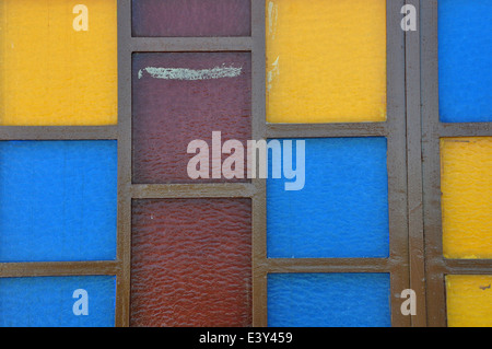 Colorful stained glass abstract squares on church window. Stock Photo